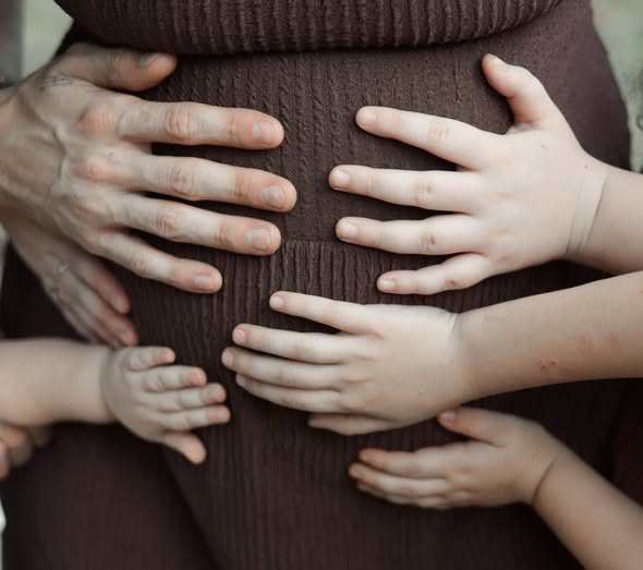 Family hands together during a photography session